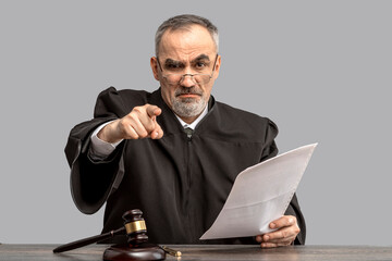 Judge banging judge's gavel, index finger pointing. Law Lord wearing gown using a hammer for attention and verdict, justice judgment at courts of law - obrazy, fototapety, plakaty