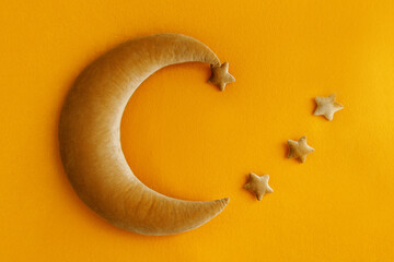 Shoot set up with moon, stars for newborn on the ginger background. Photo zone for a photo session...