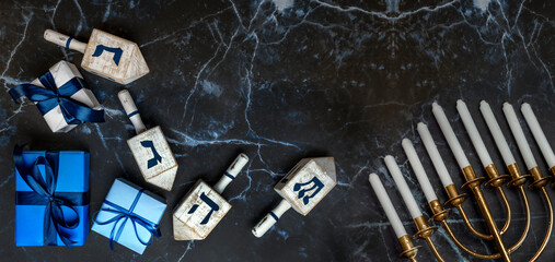 Jewish Hanukkah Menorah, book with star of David, dreidel. Holiday Candle Holder, dreidl, Talmud, or Torah. Nine-arm candlestick. Traditional Hebrew Festival of Lights candelabra. Сopy space