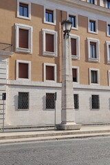 Fototapeta premium Via della Conciliazione Street View with Building Facade and Stone Lamp Post in Rome, Italy