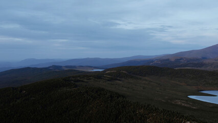 Valley of lakes with mountains and dramatic sky in Altai in evening time