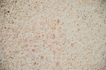 The texture of the stone is beige.Decorative stone or concrete. Rough texture. Uneven surface.Abstract background.