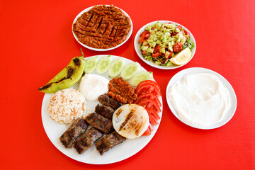 Beef steak grill with rice pilaf, fried potatoes, grilled pepper and tomatoes.Mix Platter with Beef rips, Cutlets, Potatoes and Sauces.