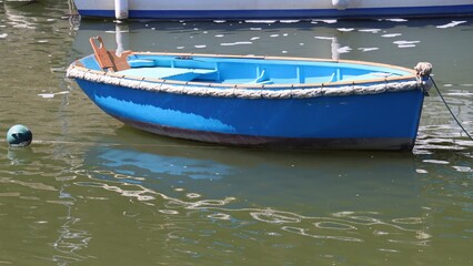 Fototapeta na wymiar Blue boat on the river