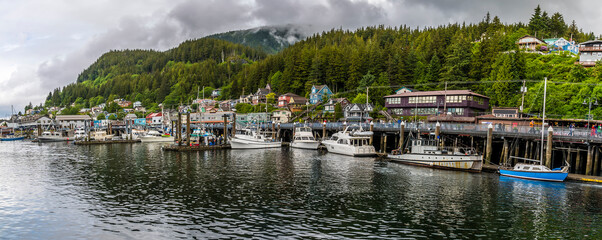 Fototapeta na wymiar A panorama view of boats moored in the harbour at Ketchikan, Alaska in summertime