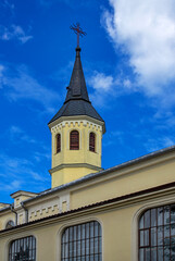 Fototapeta na wymiar Built in the years 1856-60, the Catholic church of St. Stanislaus Bishop Martyr, with a belfry, in the village of Dob Przyjałowo in Podlasie, Poland.