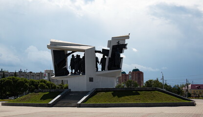 Sculptural composition of Omsk-home front workers of the Great Patriotic War 1941-1945 in the center of Omsk in summer