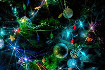 Obraz na płótnie Canvas Christmas tree lights, multicolored garland in the dark on a holiday, close-up