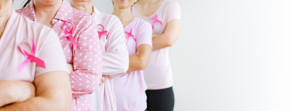 Group Of Asian Multi-age Women Power In Pink Shirt And Pink Ribbon For October Breast Cancer Awareness Month With Banner Copy Space