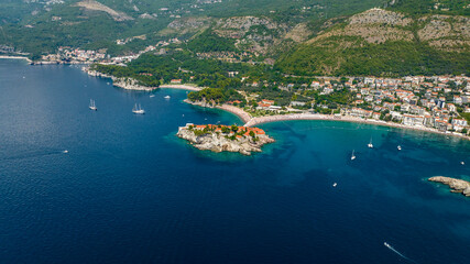 aerial view of sveti stefan island with mountains on background