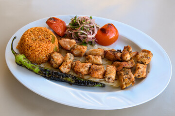 Chicken wings barbeque in a dish with BBQ grill sauce . Izgara tavuk kelebek sis kanat. Tavuk sis, gogus.