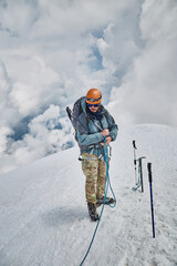 Climbing Kazbek, Georgia. male climber go to the summit.  Nature of Caucasian mountains. Mount...