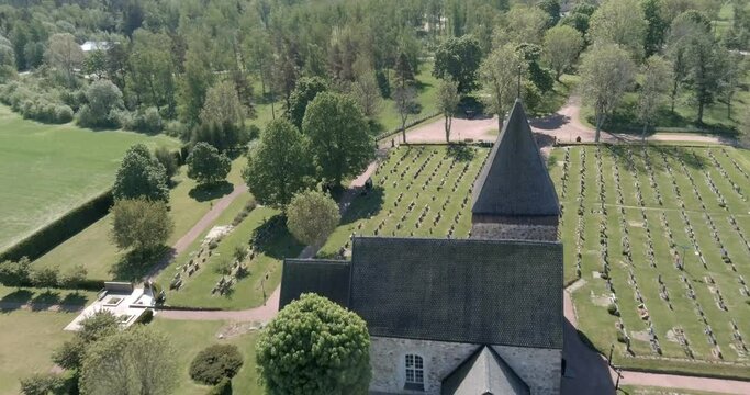 Aerial view of old Saint Catherine of Alexandria stone church in the summer at Hammarland, Ahvenanmaa, Finland.