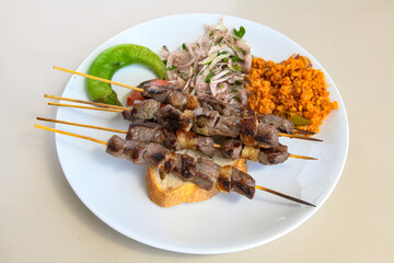 Beef steak grill with rice pilaf, fried potatoes, grilled pepper and tomatoes.Mix Platter with Beef rips, Cutlets, Potatoes and Sauces.