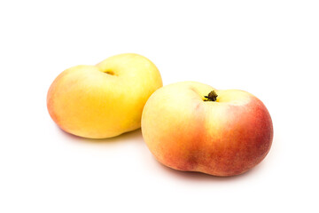 Two ripe fresh organic fig peaches isolated on white background.