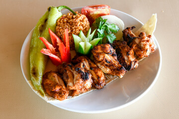 Chicken wings barbeque in a dish with BBQ grill sauce . Izgara tavuk kelebek sis kanat. Tavuk sis, gogus.