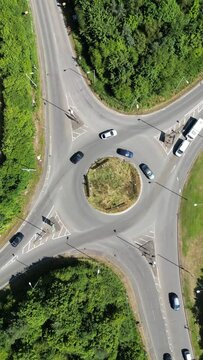 Vertical drone footage of traffic flowing over a roundabout in Shrewbury, England, United Kingdom