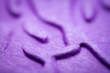 Extreme macro of embossed purple paper