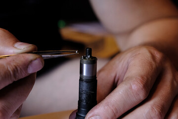 
Bearing used in bicycle hubs. A set of balls placed inside the bushing in a special bored groove (groove) and pressed against it with special cones. Bicycle bearing repair, close-up