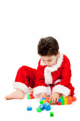 Little Santa is Playing His Playblocks on White Background