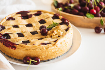 Tasty American cherry pie on white background. Top view. Copy space