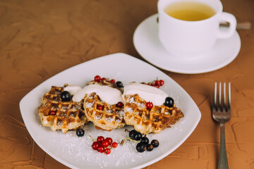 Homemade waffles with berries. Berry Belgian Waffle with raspberries. Culinary, cooking, bakery concept.