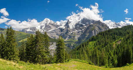 The panorma of Bernese alps with the Jungfrau, Monch and Eiger peaks.