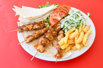 Chicken wings barbeque in a dish with BBQ grill sauce . Izgara tavuk kelebek sis kanat. Tavuk sis, gogus.