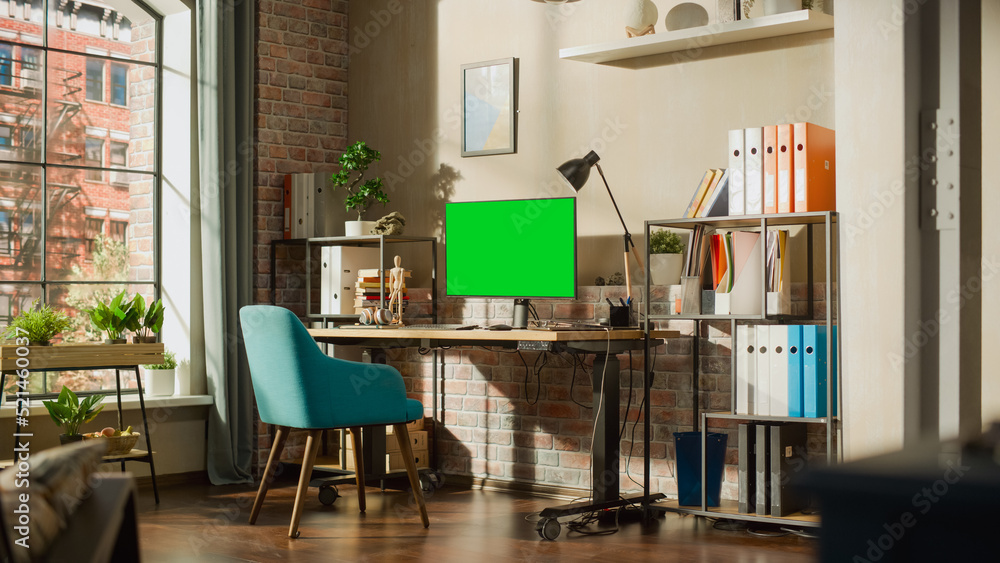 Poster desktop computer monitor standing on height adjustable desk with a green screen chromakey mock up di