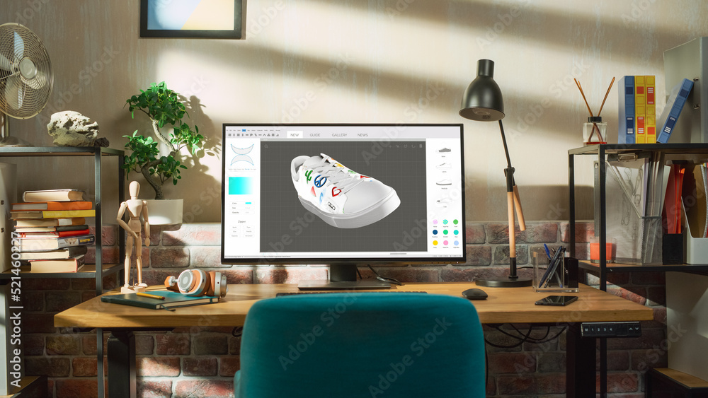 Poster Desktop Computer Monitor Standing on a Table with 3D Design Softwear Processing a Model of Shoe. Cozy Empty Loft Apartment with Big Window with a Lamp, Notebook and Headphones on the Table.