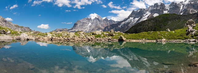 The panorma of Oberhornsee with the Jungfrau, Mittaghorn and Grosshorn peaks.