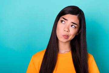 Fototapeta premium Photo of gorgeous pretty lovely girl long hairdo dressed yellow t-short decide what to buy on sale isolated on turquoise color background