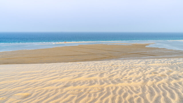 qatar adventurous place khor al udeid ,sea line beach during sunset.