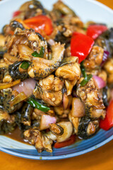 A delicious Chinese dish, fried bullfrog in sauce