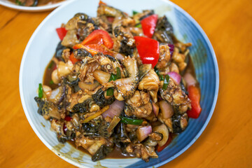 A delicious Chinese dish, fried bullfrog in sauce