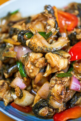 A delicious Chinese dish, fried bullfrog in sauce