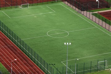 Photo of a football field in summer. Empty football field