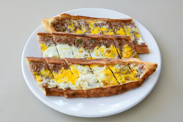 Turkish pita with minced cubed meat and cheese (Turkish name: Kiyma Kusbasi kasarli pide)