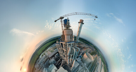 Aerial view from high altitude of little planet earth with cement factory tower with high concrete...