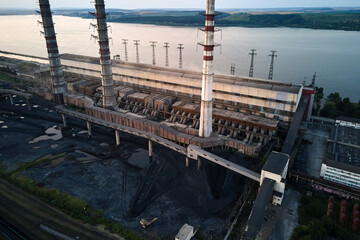 Aerial view of coal power plant high pipes with black smokestack polluting atmosphere. Electricity...