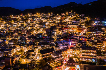 Fototapeta premium aerial view of night scene of Jioufen village, Taiwan. The colourful scene at night of Jiufen old city, Jiufen, Taiwan.