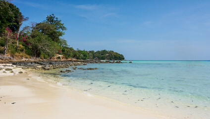 Fototapeta na wymiar Paradise tropical beach with white sand and turquoise sea. Vacation and travel in Thailand