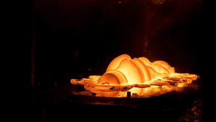 Close up of metal forging process of a metal detail at the metallurgical plant. Scene. The...