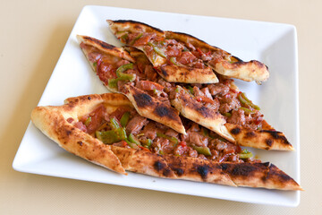 Turkish pita with minced cubed meat and cheese (Turkish name: Kiyma Kusbasi kasarli pide)
