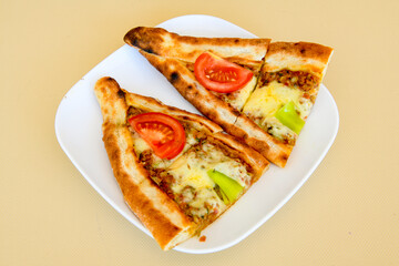 Turkish pita with minced cubed meat and cheese (Turkish name: Kiyma Kusbasi kasarli pide)