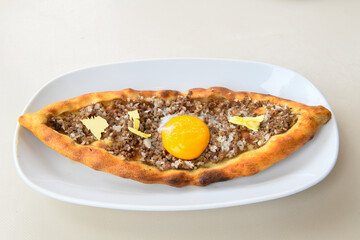 Turkish pita with minced cubed meat and cheese (Turkish name: Kiyma Kusbasi kasarli pide)
