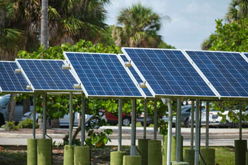 Solar panels installed on stand frame near parking lot for effective generation of clean...