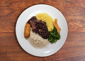 Delicious feijoada plate. Brazilian typical cuisine made with black beans and pork