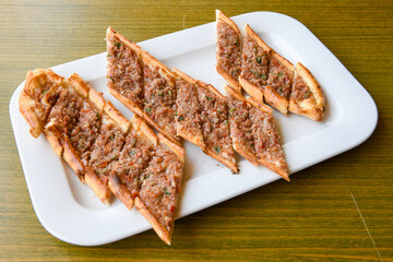 Turkish pita with minced cubed meat and cheese (Turkish name: Kiyma Kusbasi kasarli pide)