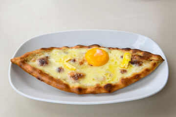Turkish pita with minced cubed meat and cheese (Turkish name: Kiyma Kusbasi kasarli pide)